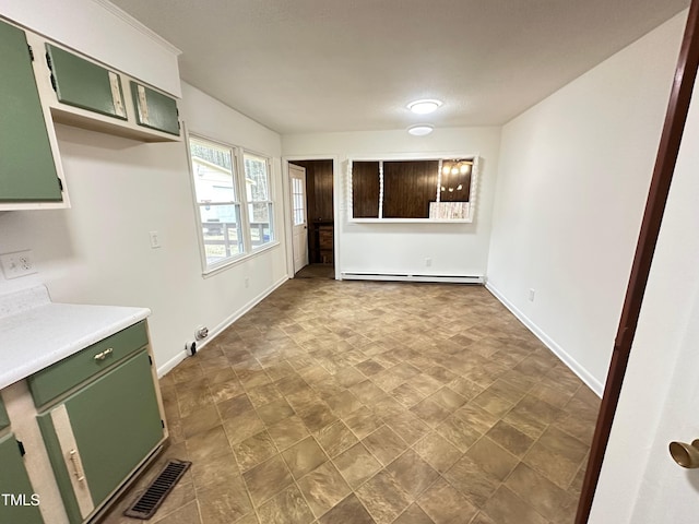 unfurnished dining area with a baseboard radiator