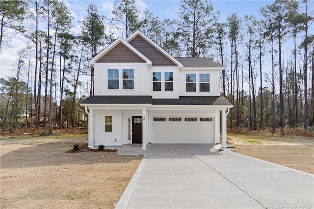 view of front of home with driveway, a garage, and board and batten siding