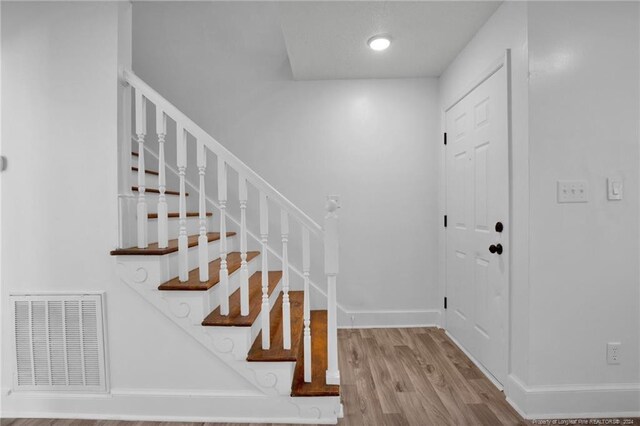 foyer with hardwood / wood-style flooring