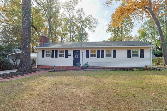 ranch-style house featuring a front lawn and a carport