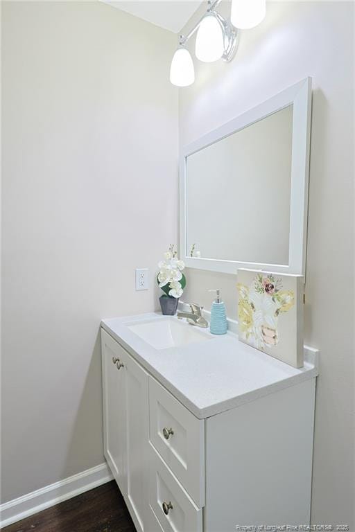 bathroom with vanity and wood-type flooring