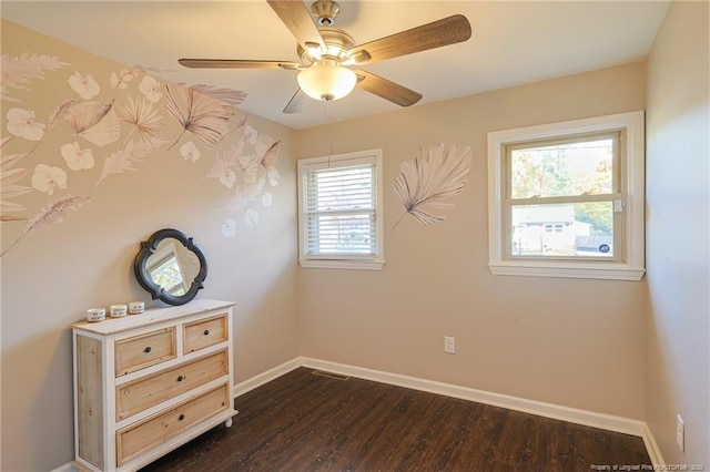 interior space with ceiling fan and dark wood-type flooring