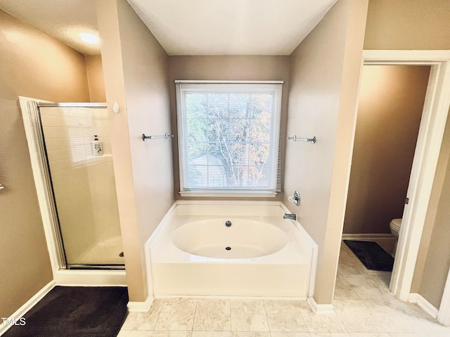 bathroom with tile patterned flooring, plus walk in shower, and toilet