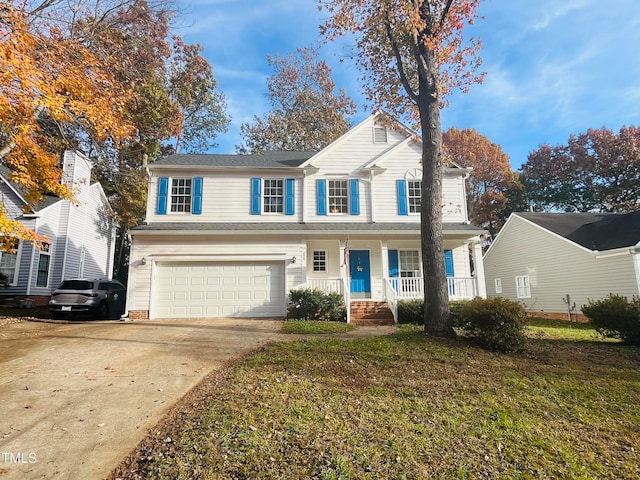 front of property featuring a garage, covered porch, and a front lawn