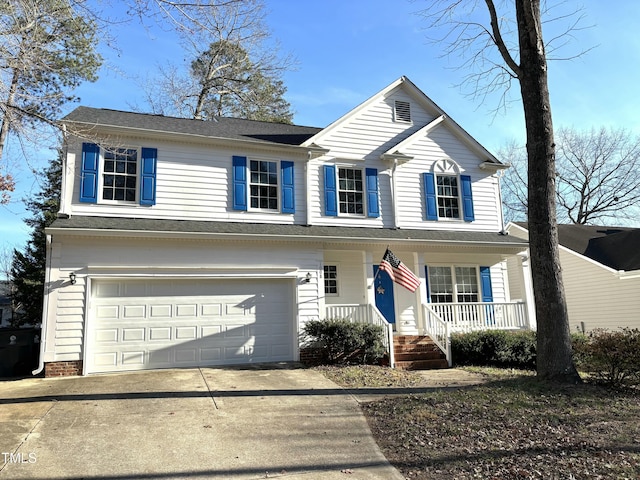 view of front property with a garage and covered porch