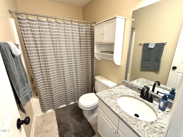 full bathroom featuring vanity, shower / tub combo, tile patterned floors, and toilet