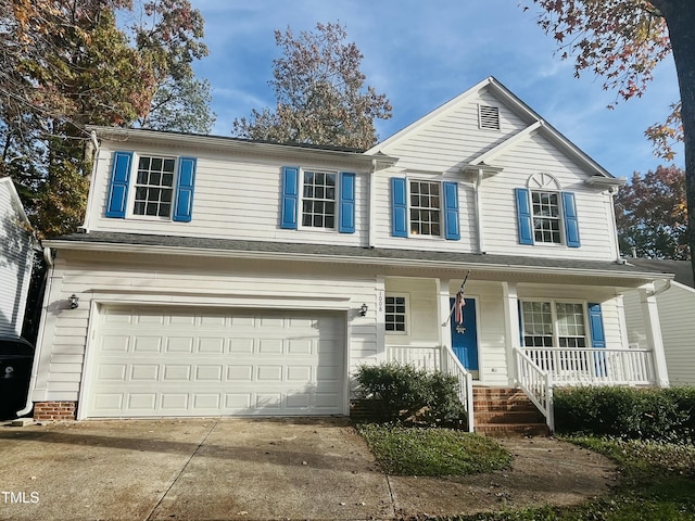 view of front of home with a garage and a porch