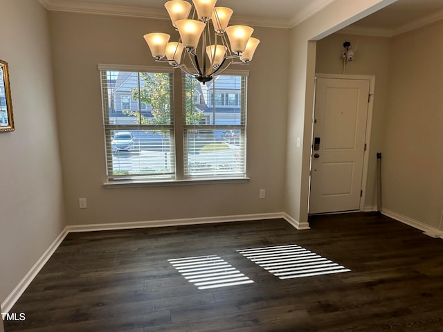 unfurnished dining area featuring dark hardwood / wood-style floors, crown molding, and a chandelier