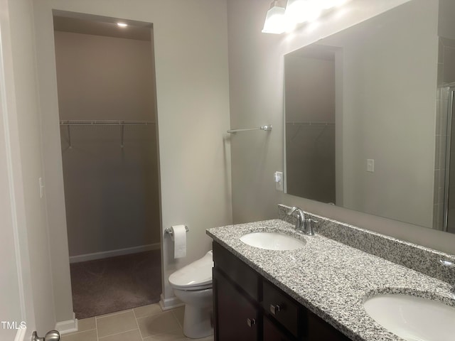 bathroom with tile patterned floors, vanity, and toilet