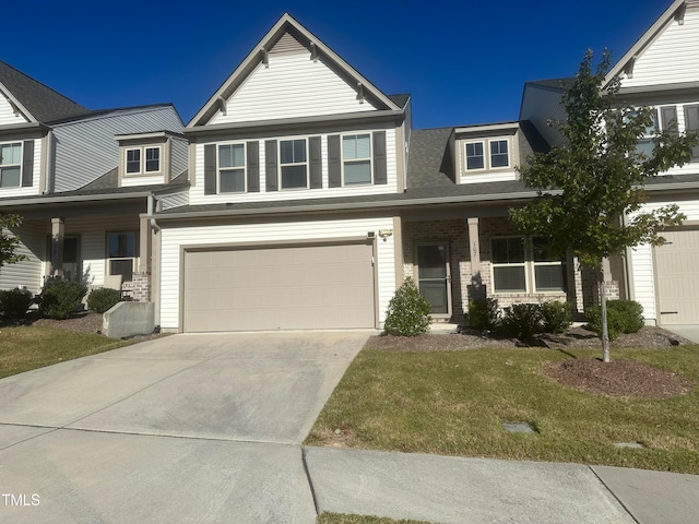 view of front of home featuring a front yard and a garage