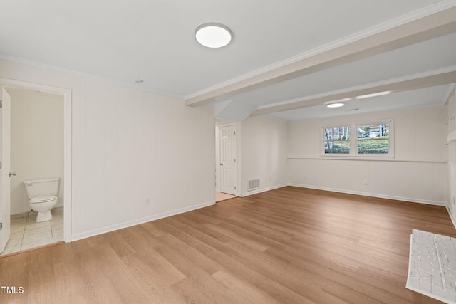 unfurnished room with light hardwood / wood-style floors and crown molding