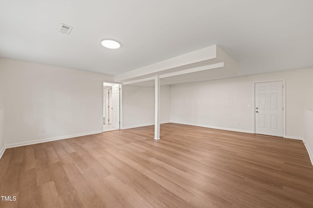 basement featuring light hardwood / wood-style floors