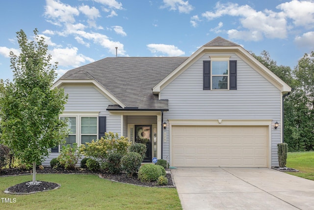 view of front of property featuring a front lawn and a garage