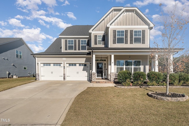 craftsman-style house featuring a garage and a front yard