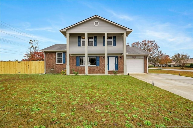 view of front of house featuring a front lawn and a garage