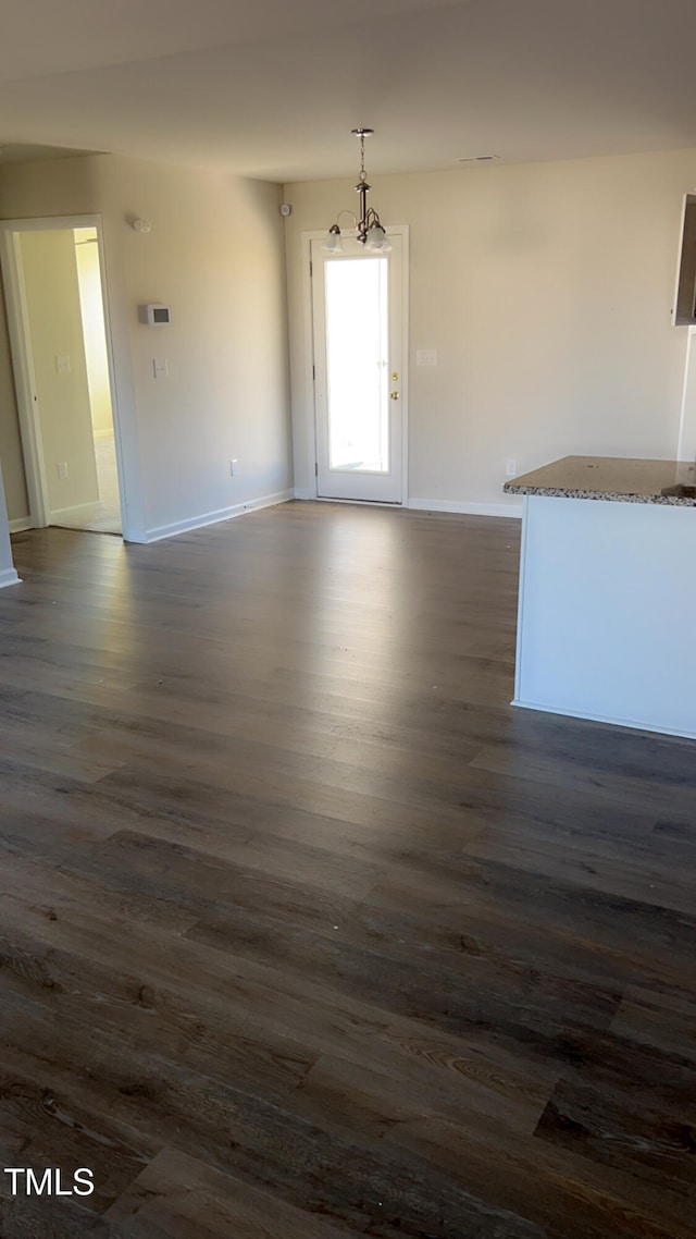 spare room featuring dark hardwood / wood-style floors