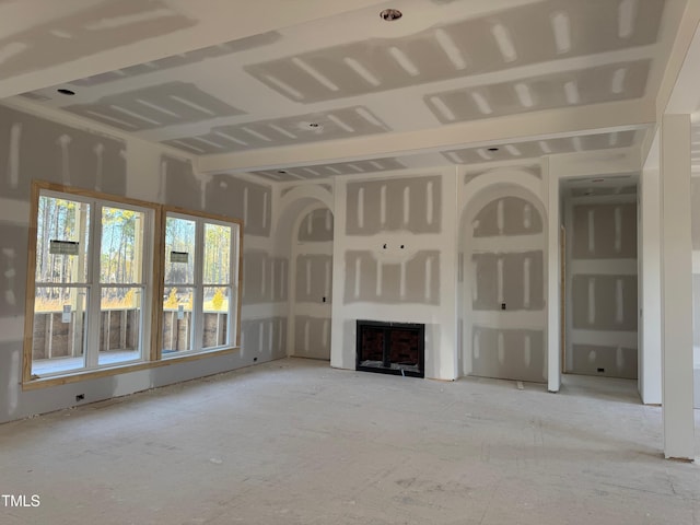 unfurnished living room featuring a fireplace