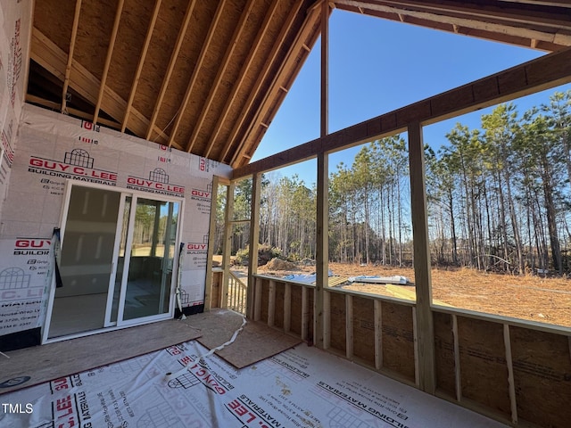 unfurnished sunroom with lofted ceiling