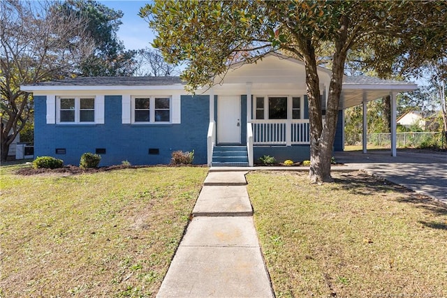 view of front of house with covered porch, a carport, and a front lawn