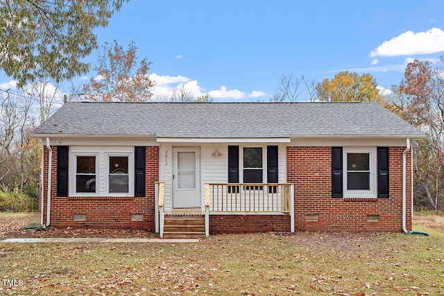 view of front of home featuring a front lawn and covered porch