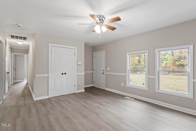 unfurnished bedroom featuring ceiling fan and light hardwood / wood-style flooring