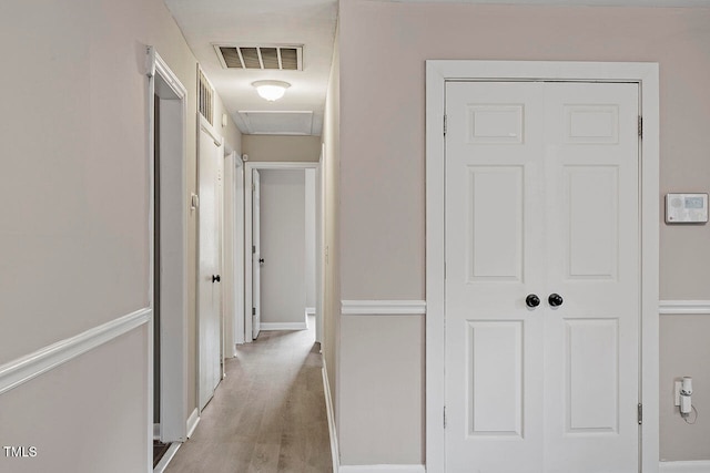 hall with light hardwood / wood-style flooring