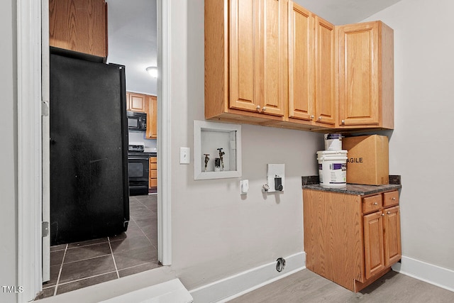 laundry room featuring cabinets, washer hookup, tile patterned flooring, and hookup for an electric dryer