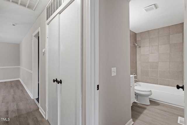 corridor featuring light hardwood / wood-style floors