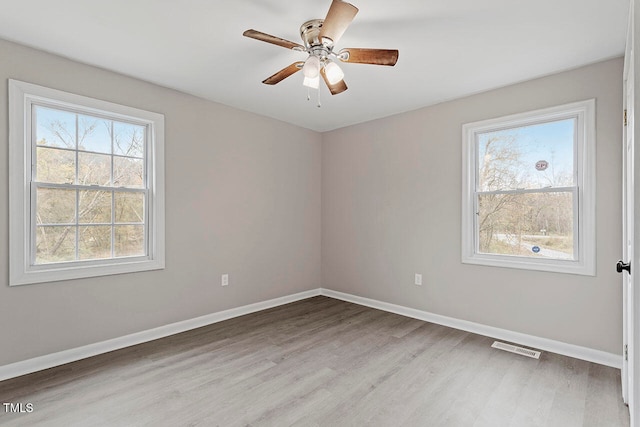 unfurnished room with light hardwood / wood-style floors and ceiling fan