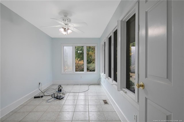 sunroom / solarium with ceiling fan