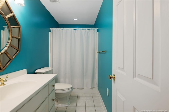 full bathroom with tile patterned flooring, shower / bath combination with curtain, vanity, and toilet