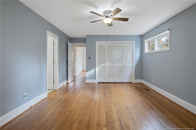 unfurnished bedroom with ceiling fan and light hardwood / wood-style flooring