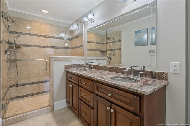 bathroom featuring crown molding, tile patterned flooring, vanity, and an enclosed shower