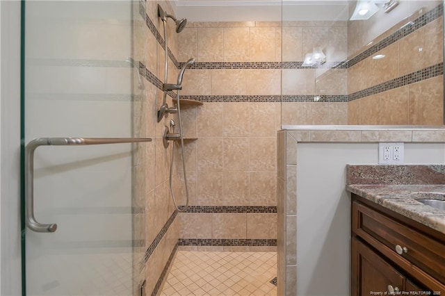 bathroom featuring vanity and an enclosed shower