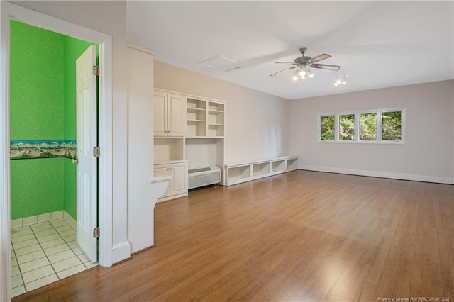 interior space featuring light hardwood / wood-style flooring and ceiling fan