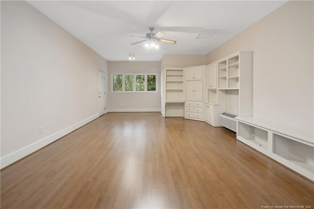 unfurnished living room featuring hardwood / wood-style floors and ceiling fan