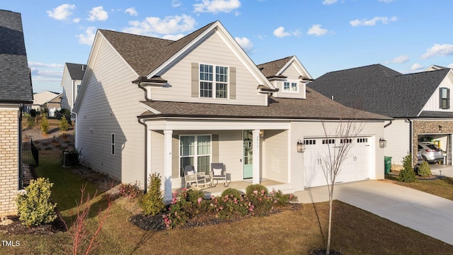 view of front facade featuring a garage and covered porch