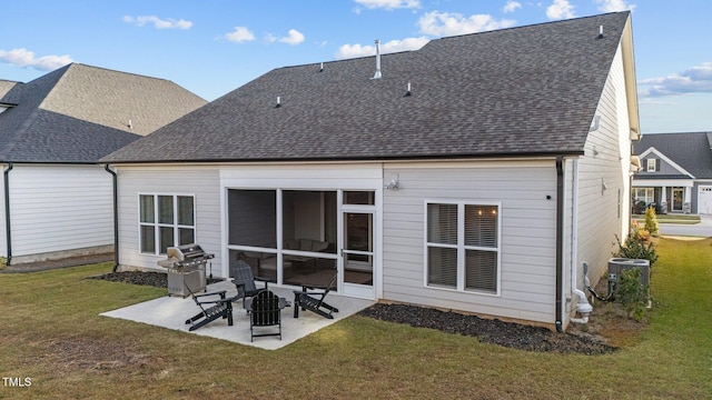 back of house with a yard, a sunroom, a patio area, and central air condition unit