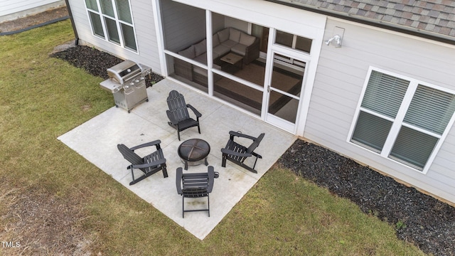 view of patio / terrace featuring a grill and a fire pit