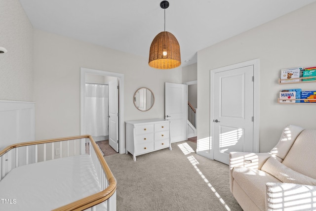 bedroom featuring light colored carpet