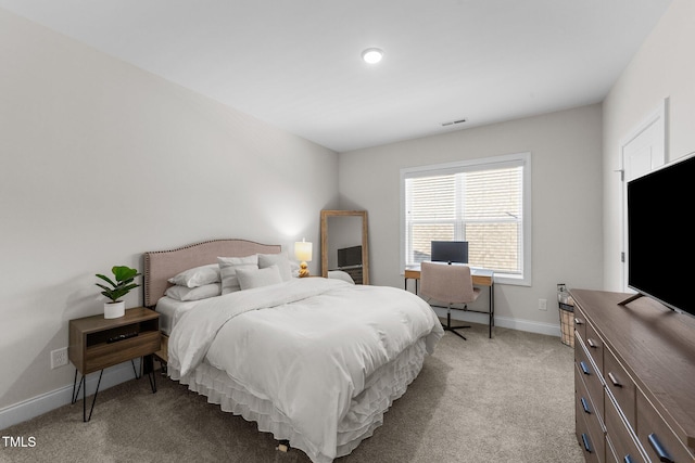 bedroom with light colored carpet