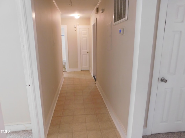 hall featuring light tile patterned floors