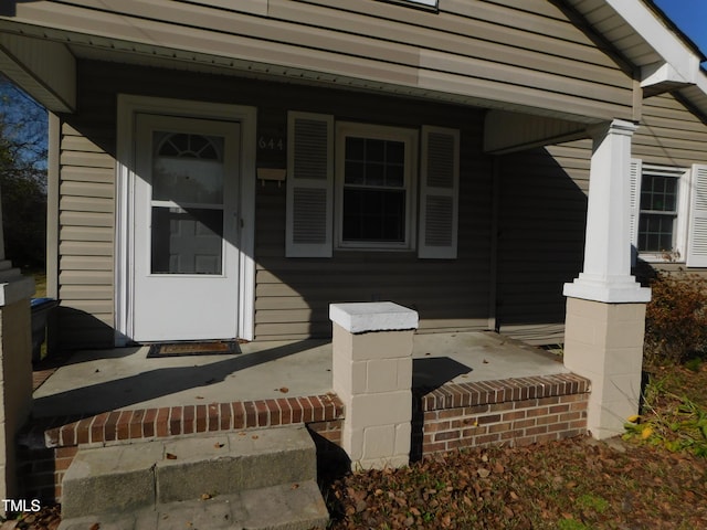 doorway to property featuring a porch