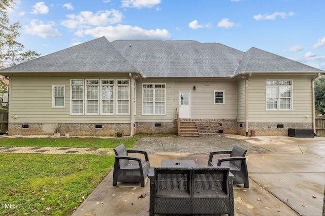 rear view of house featuring a lawn and a patio