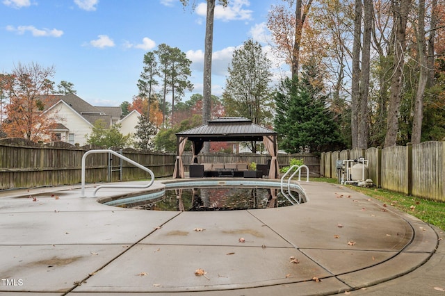 view of swimming pool featuring a gazebo