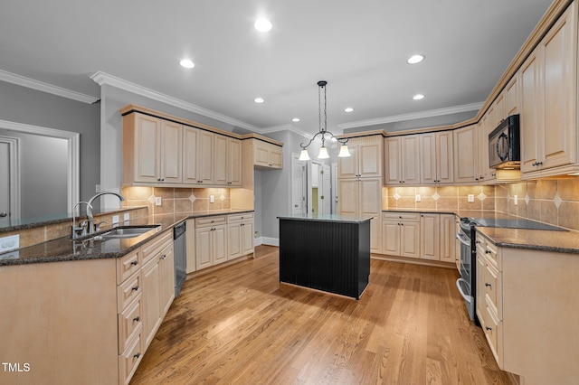 kitchen with a center island, sink, light hardwood / wood-style flooring, light brown cabinetry, and stainless steel appliances