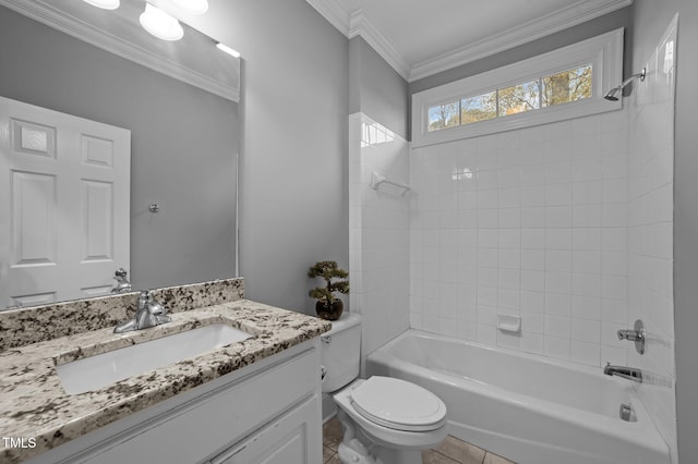 full bathroom with vanity, tile patterned floors, crown molding, tiled shower / bath, and toilet