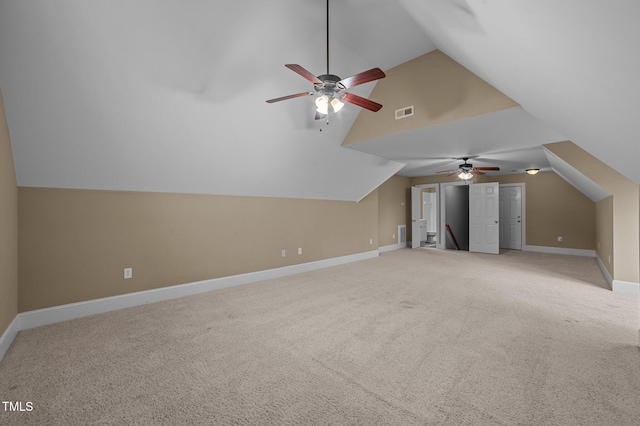 bonus room featuring carpet flooring, ceiling fan, and vaulted ceiling