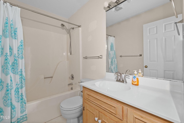 full bathroom with tile patterned floors, shower / bath combination with curtain, toilet, and vanity