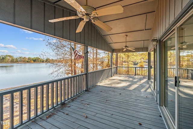 wooden terrace with ceiling fan and a water view